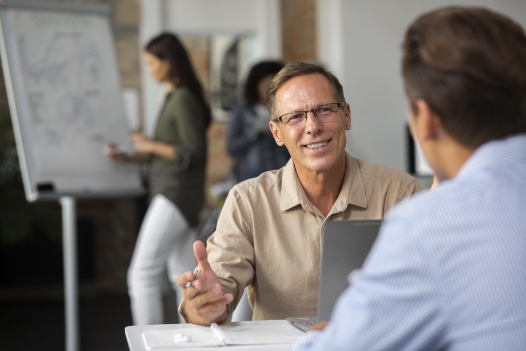 people using digital device while meeting